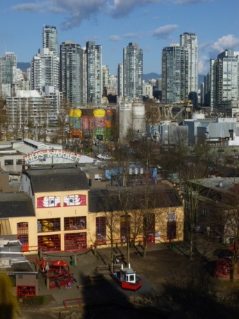 Granville Island, as seen from the Granville Street Bridge (with Downtown in the distance)